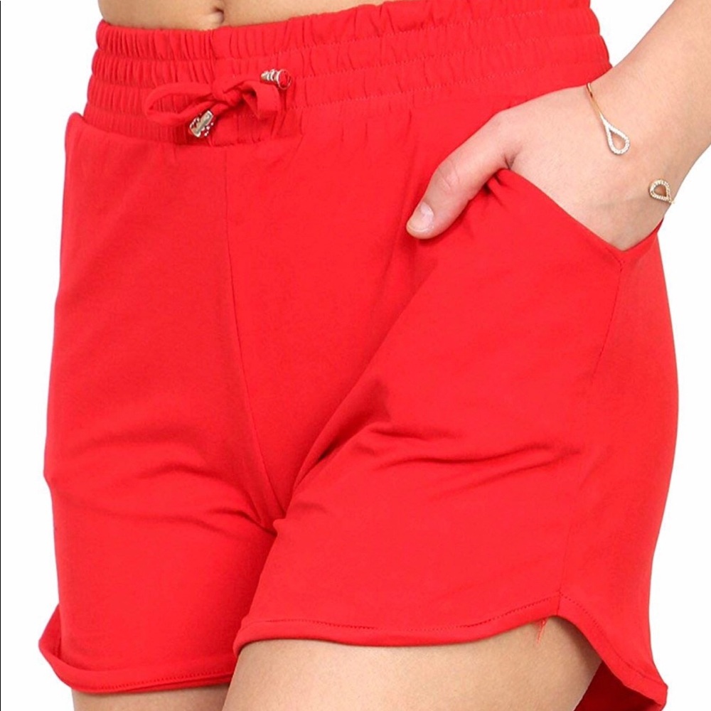 Coral shorts. 85% polyester 15% spandex